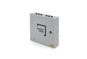 A gray rectangular smoke vent control box with multiple cable entry points on the top and a lockable access panel on the front labeled 